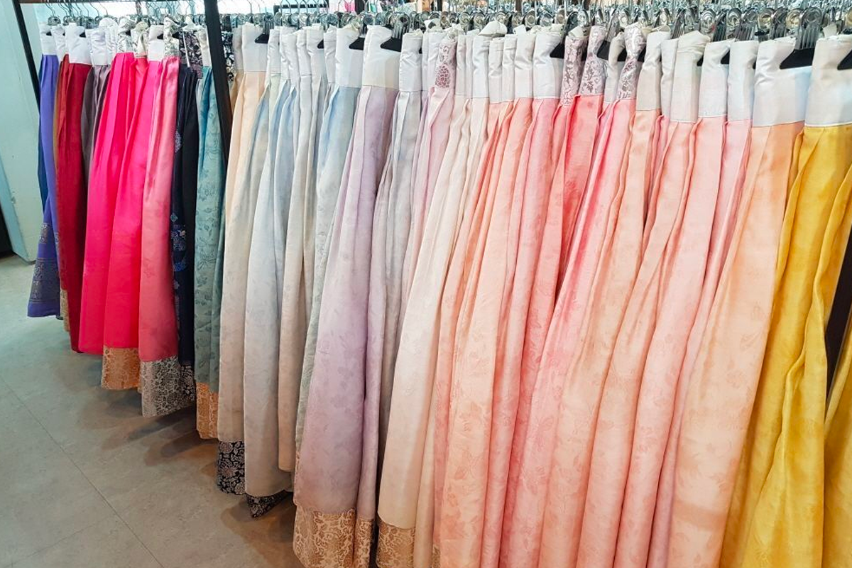 Modern Hanbok dress with floral patterns showcased at InKorea Hanbok rental.