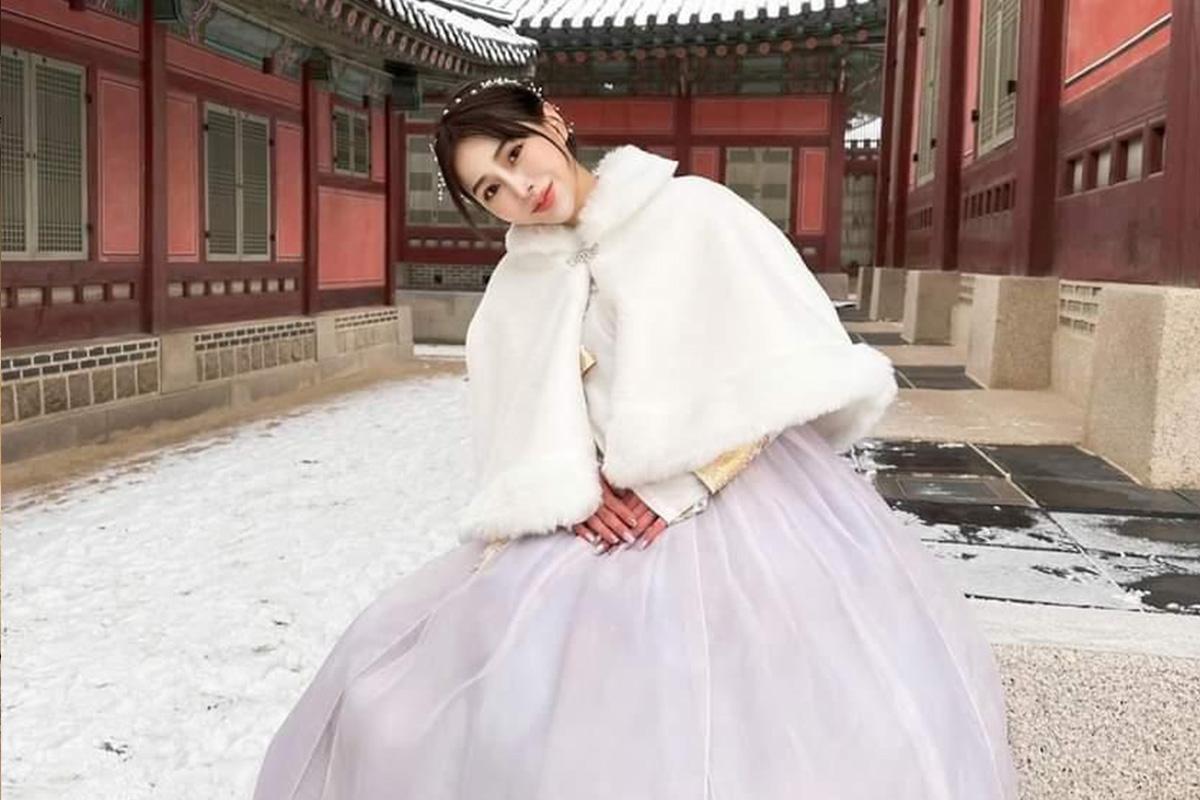 Royal Queen Hanbok dress with velvet cape at Gyeongbokgung Palace, Seoul.