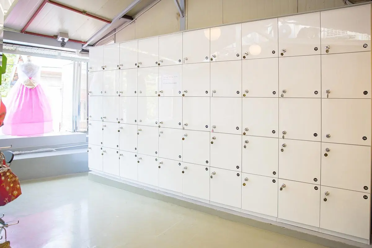 A locker area inside Ohnelharu Hanbok rental shop. Rows of white lockers are available for hanbok rental customers.