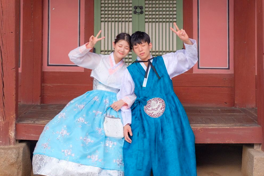 Inside the 'Ohneul Haru Hanbok' shop, showcasing a bustling selection of hanbok.