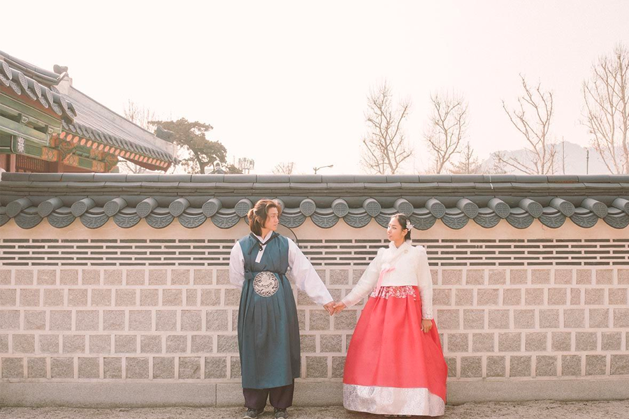 Exterior view of hanbok shop near Gyeongbokgung, displaying colorful dresses.