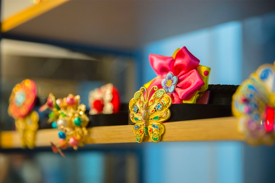 Vibrant display of hanbok accessories and floral arrangements inside the rental shop.