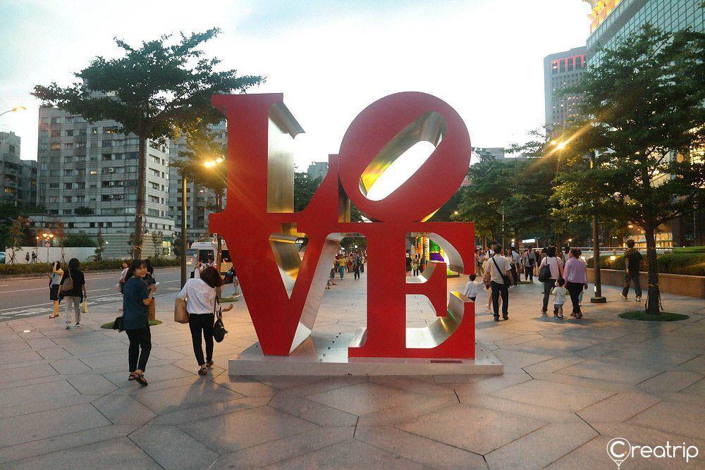 LOVE sculpture in front of Taipei 101, a popular photo spot for tourists visiting Taipei, Taiwan.