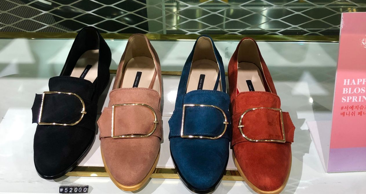 SOVO premium loafer shoes in bright colors with prominent buckles, illustrating their unique and high-end designs.