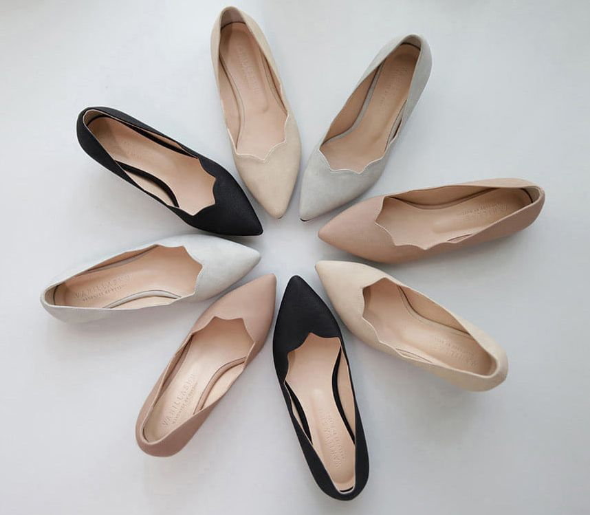 VANILLASHU pointed-toe heels in neutral tones arranged in a circle, showcasing the diverse range of colors and styles available.