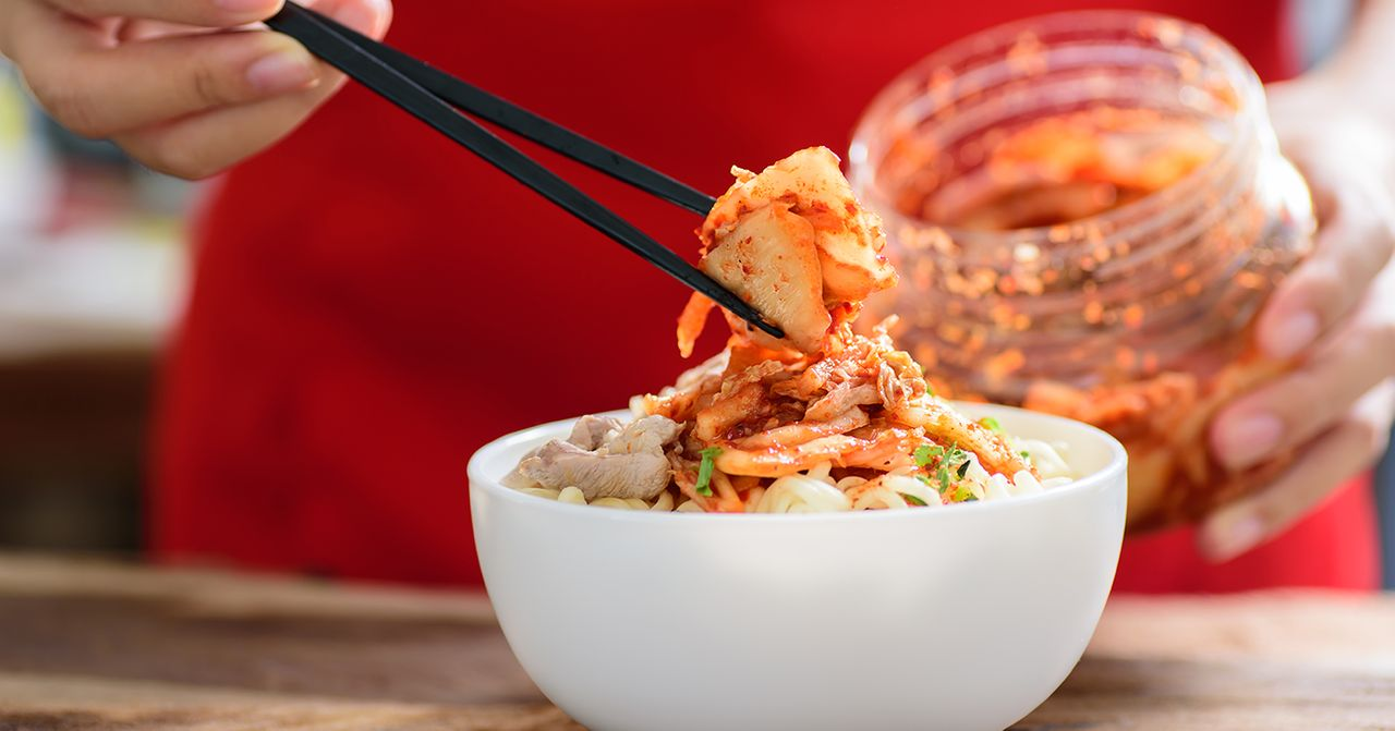 Bowls of Korean sashimi salad topped with sesame seeds and roe.