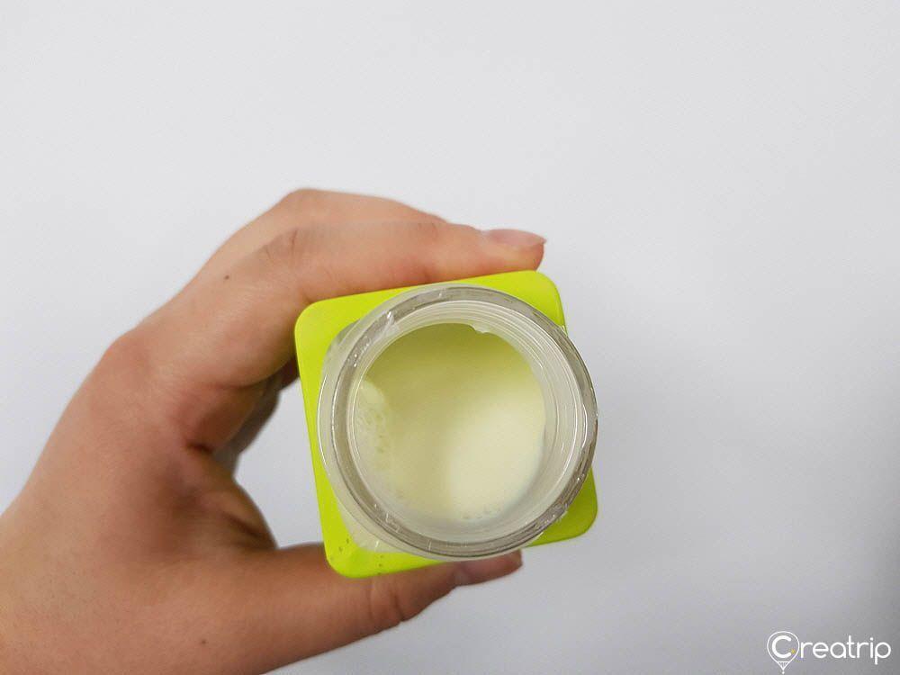 Open bottle revealing creamy Melona drink mimicking the famous melon ice cream bar