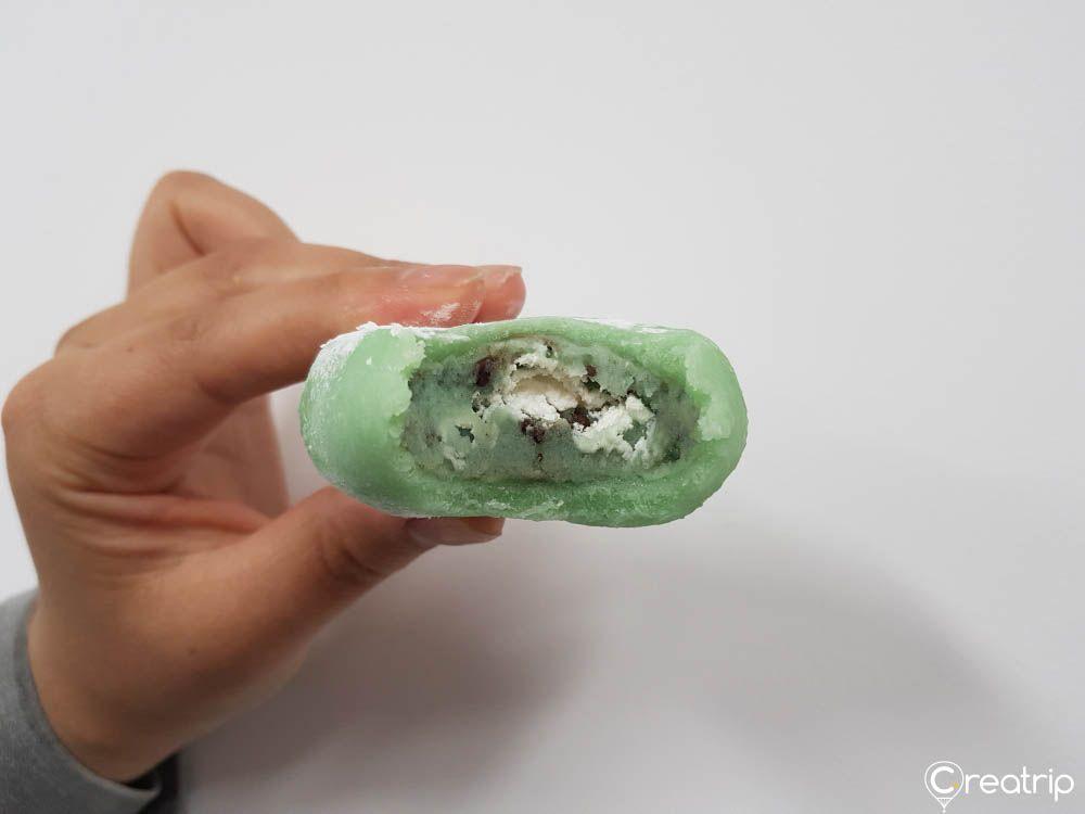 Cross-section of mint chocolate cream mochi showing the soft texture and cream filling