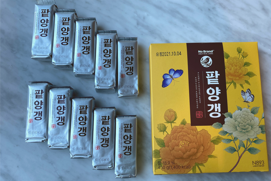 No Brand's traditional red bean jelly elegantly packaged in an ornate box lined with artistic floral imagery, perfect for gifting or enjoying as a health-conscious dessert.