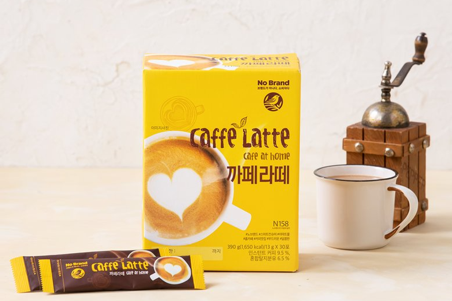 An inviting box of No Brand cafe latte with a sachet and prepared coffee cup, ideal for a quick cafe-quality latte experience at home or on the go.