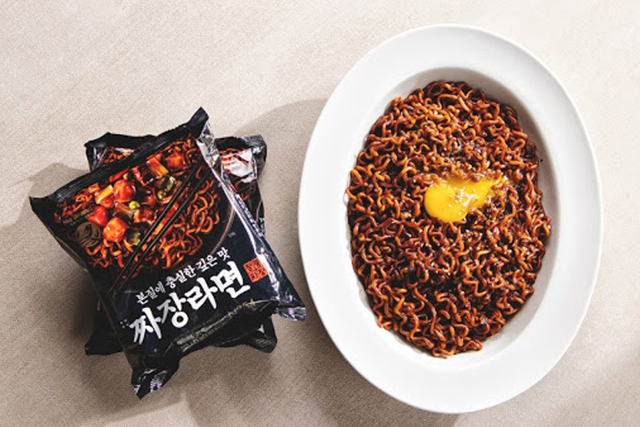 Plated jajang ramen featuring cooked noodles with rich black bean sauce from No Brand. An indulgent representation of Korean cuisine perfect for those seeking hearty flavors.