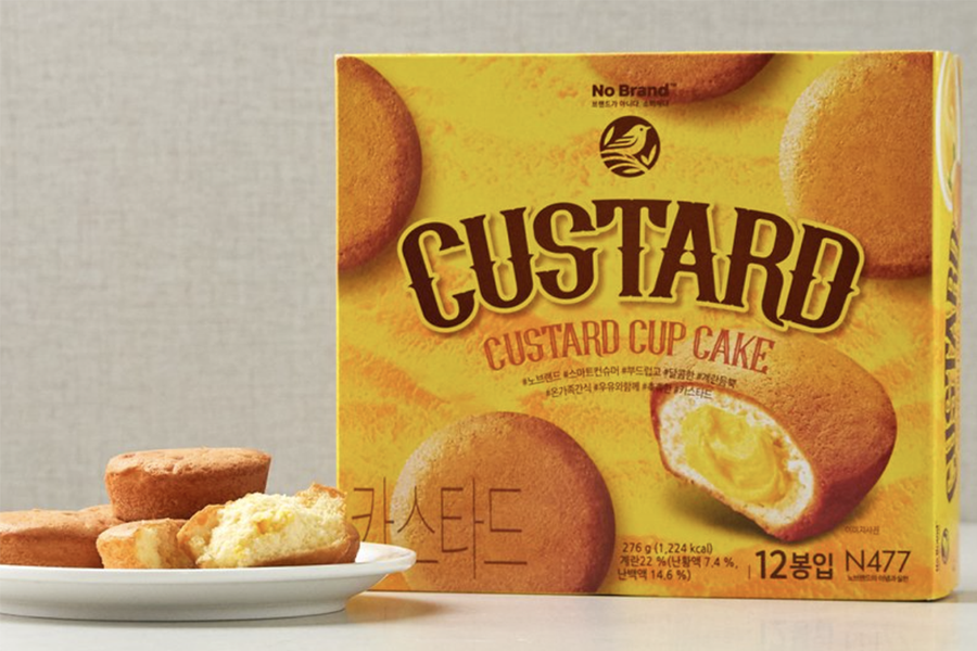 No Brand custard cupcakes, showcasing the fluffy center. Known for their soft texture and rich filling, these cupcakes are a delightful dessert option.