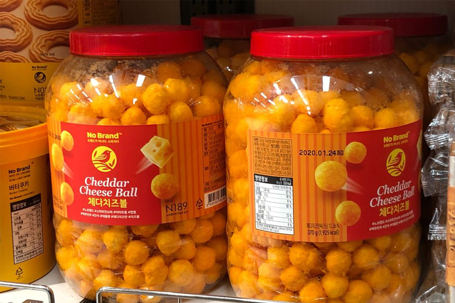 Large jars of No Brand cheddar cheese balls with a vivid orange hue. This popular snack option is renowned for its bold flavor and satisfying crunch, making it a favorite for cheese lovers.