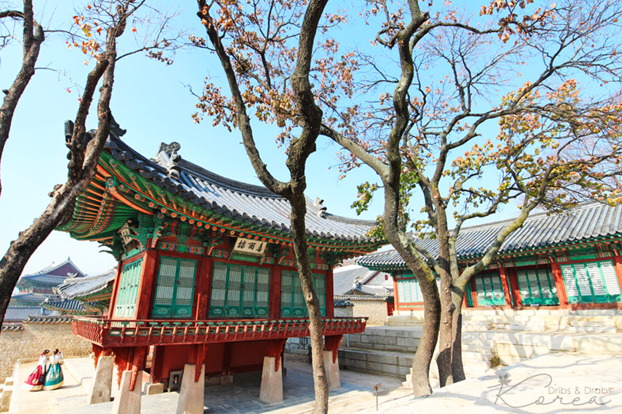 Scenic view of Changdeokgung Palace with traditional Korean architecture surrounded by trees