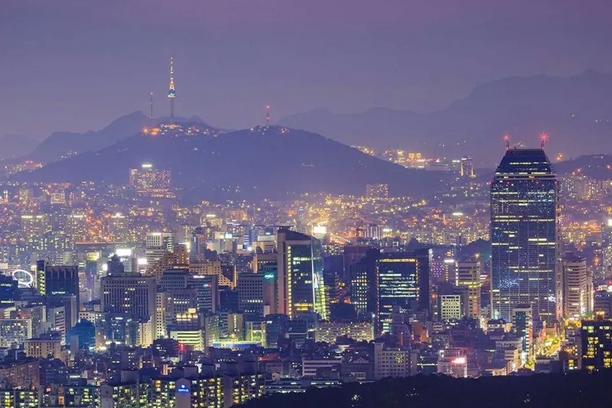 Seoul cityscape at night, illustrating the high cost of living and housing in South Korea.