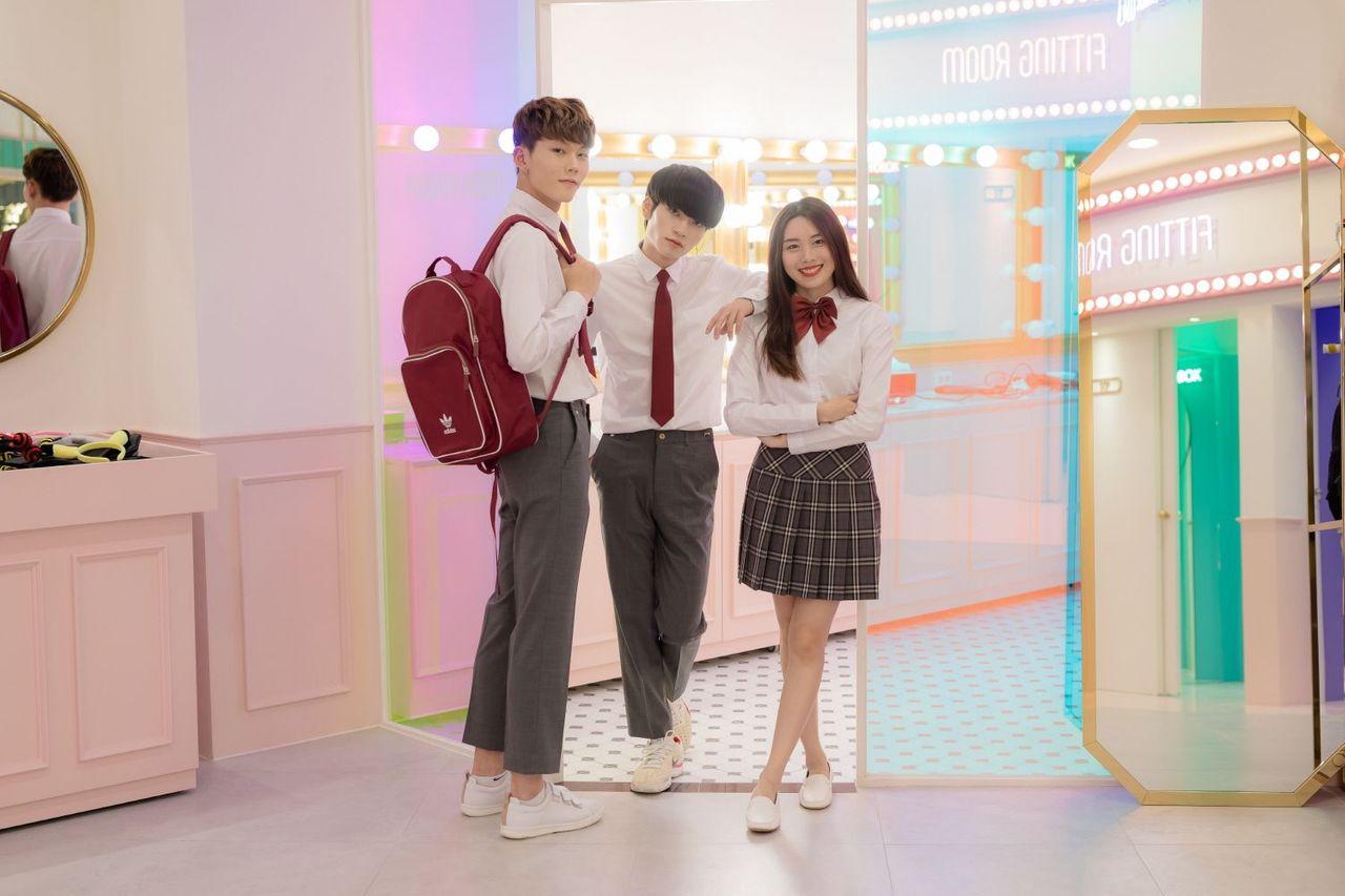 Visitors wearing trendy school uniforms at Ehwa School Uniform