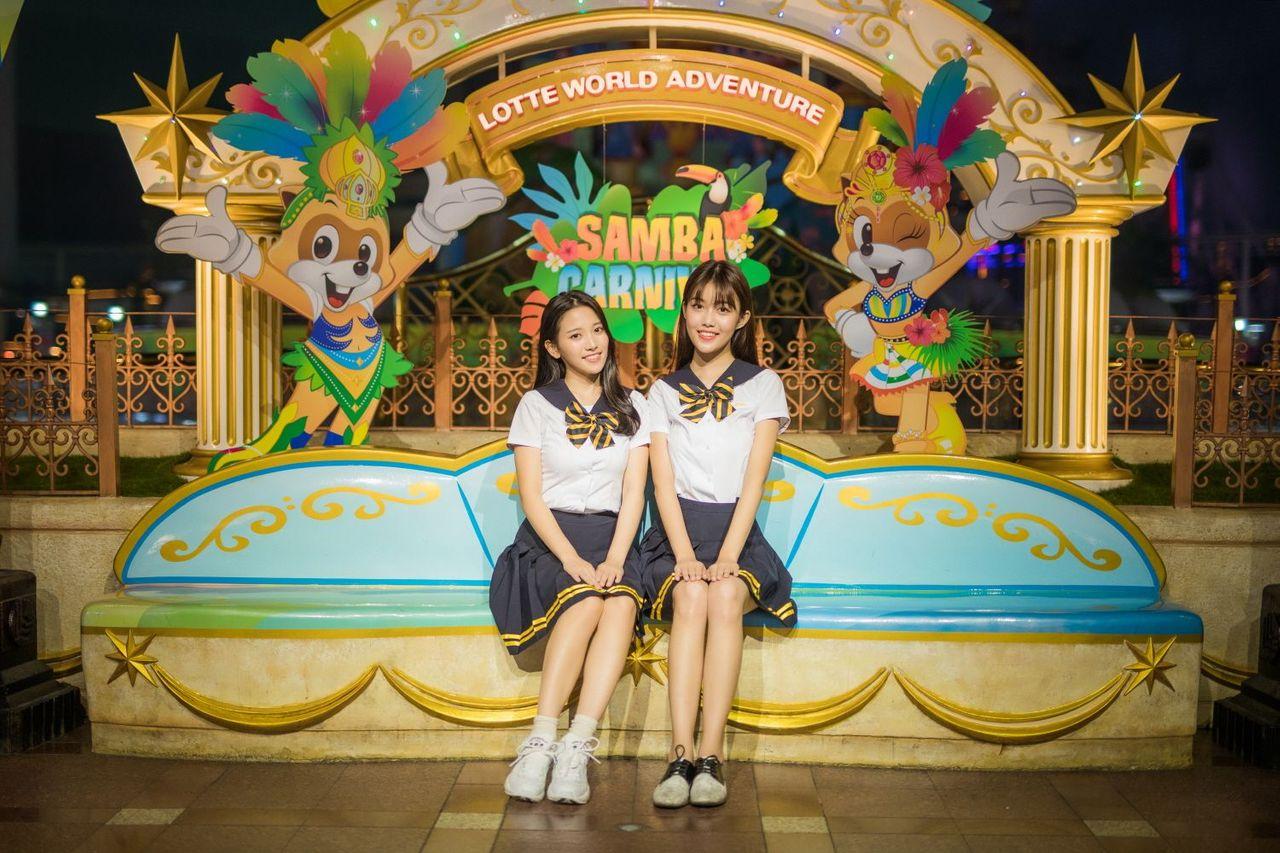 Organized display of accessories and uniforms at Ehwa School Uniform with visitors engaging in the fashion rental experience.