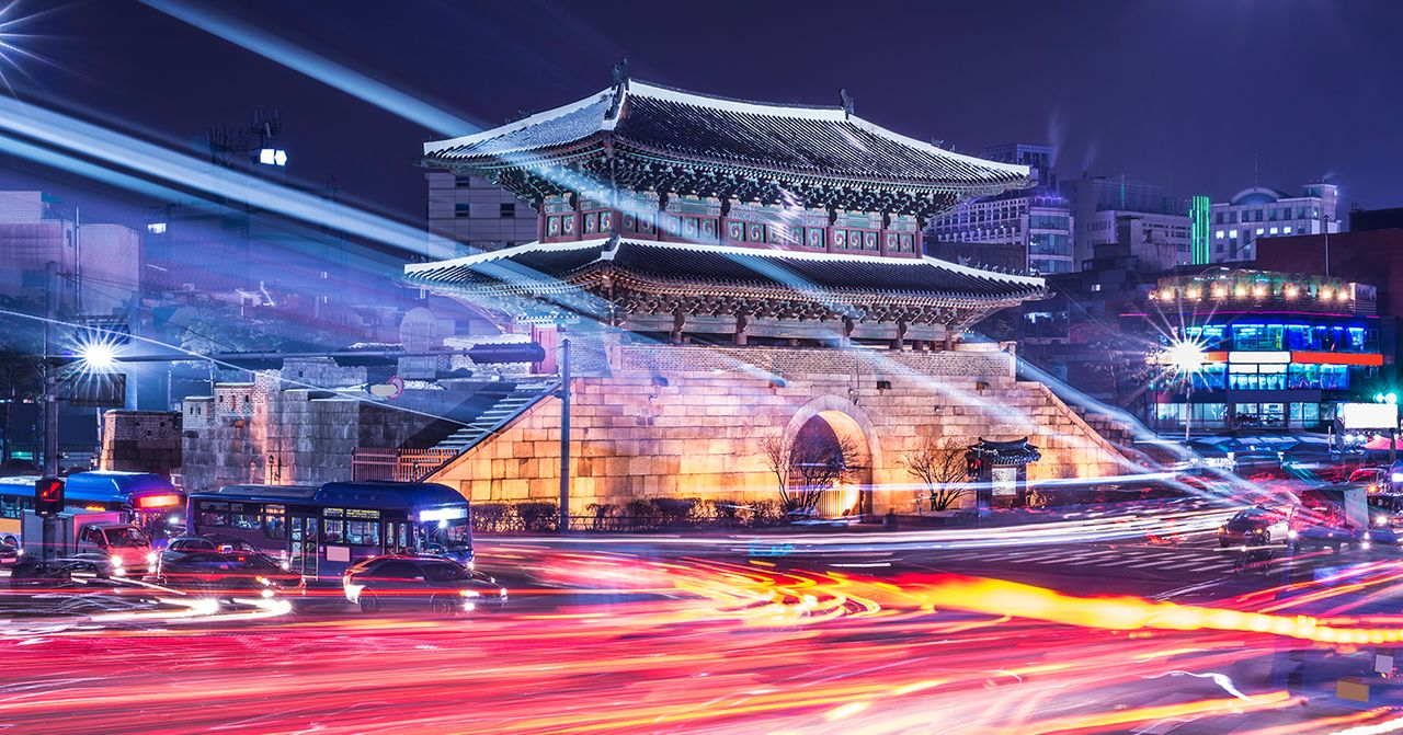 Vibrant street scene at Dongdaemun, featuring local food stalls and cultural highlights ideal for Seoul tourists.