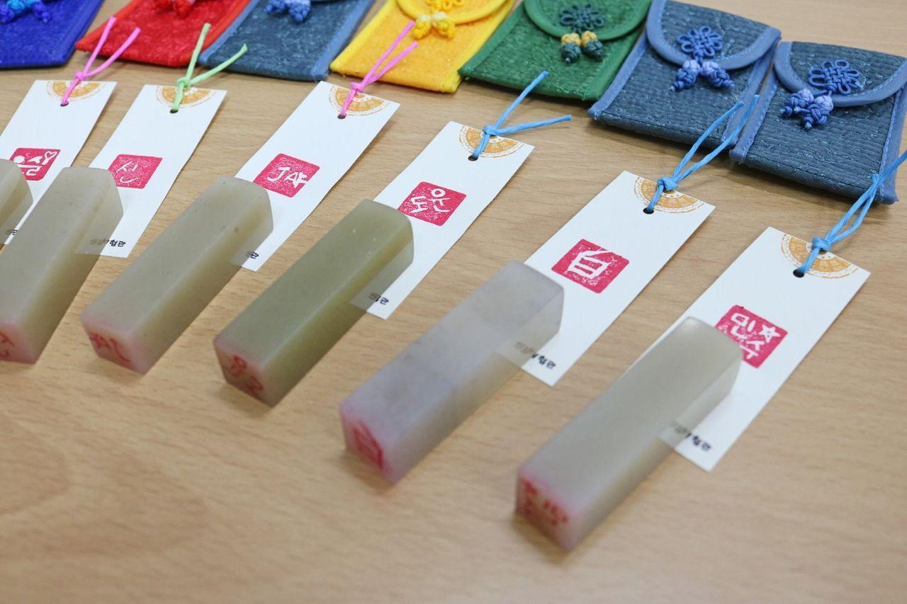 Drawing and engraving tools on a desk at Insadong K-Art Center, providing everything necessary for participants to carve personalized seals.