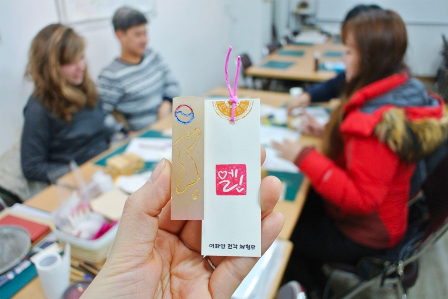 DIY stamp and bookmark creation at Insadong's K-Art Center.