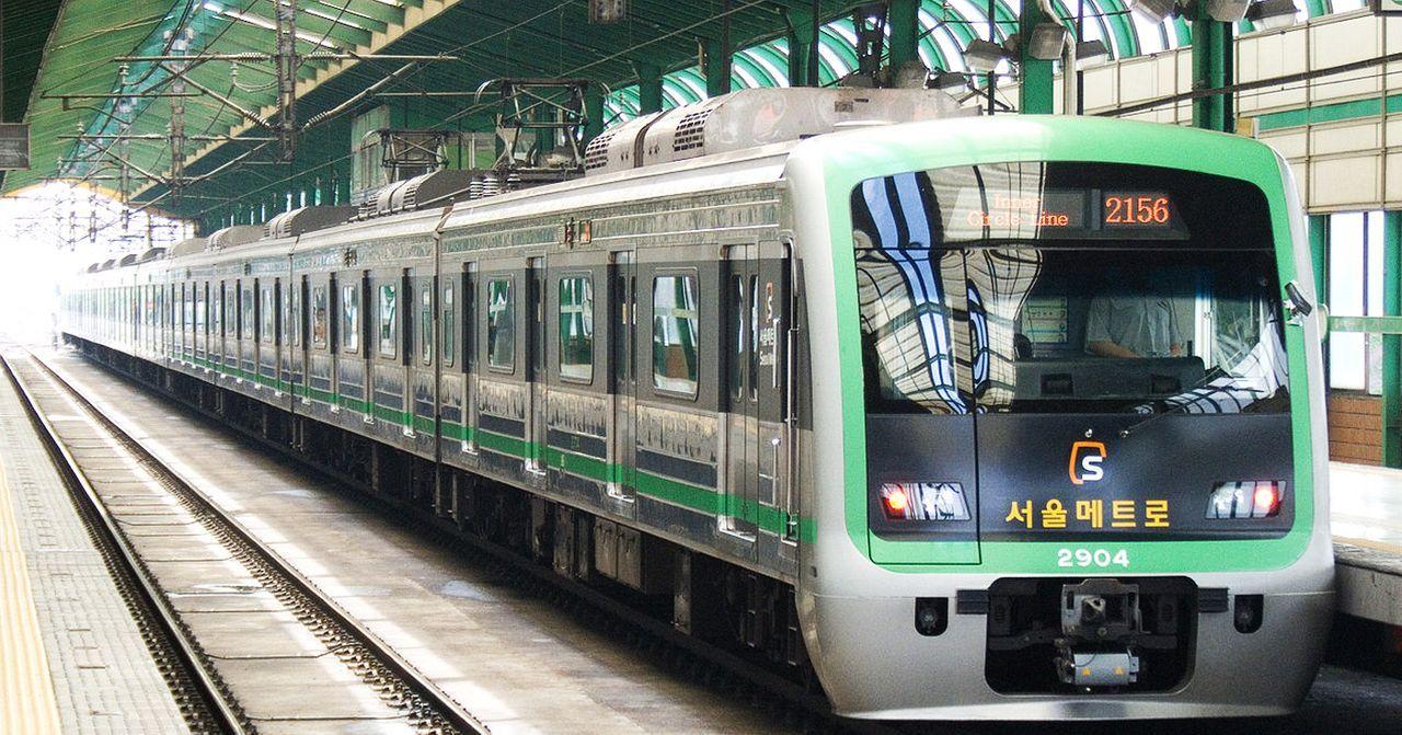 Seoul Metro train at an urban station, highlighting Korea's efficient public transport system.