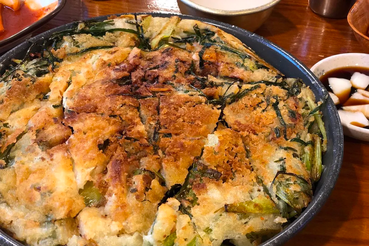 Side menu options in Korean cuisine like Kimchi Pancake and Seafood Pancake.