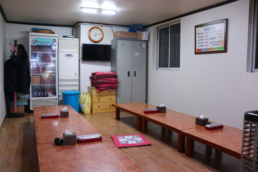 Traditional Korean seating area in a restaurant where guests eat while sitting on the floor.
