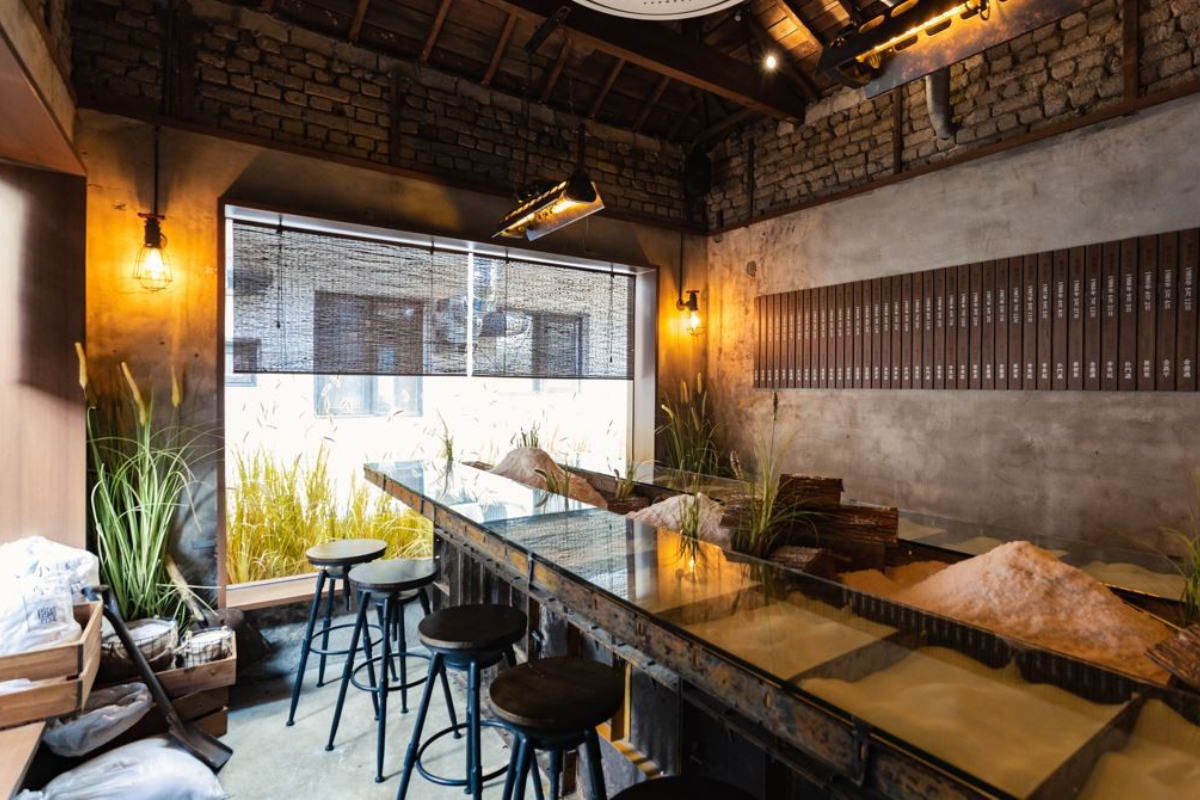 Soha Salt Pond's charming bakery interior in Yeonnam-dong featuring a variety of unique salt bread varieties.