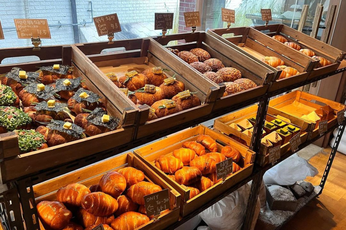 Variety of artisan breads at Soha Salt Pond in Yeonnam-dong, showcasing intricate and flavorful options like truffle salt bread.