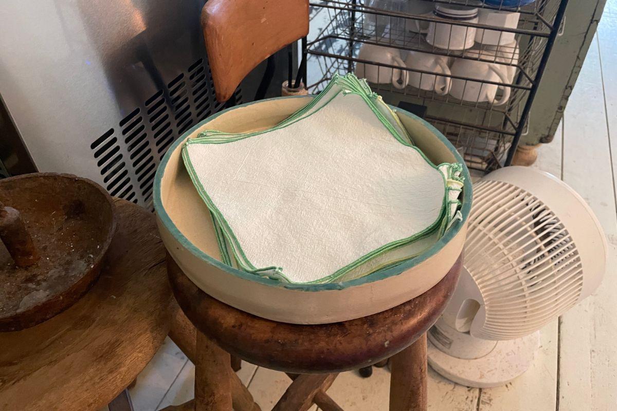 Eco-friendly reusable napkins displayed at 'earth us' cafe in Yeonnam-dong, Seoul, promoting sustainable practices.