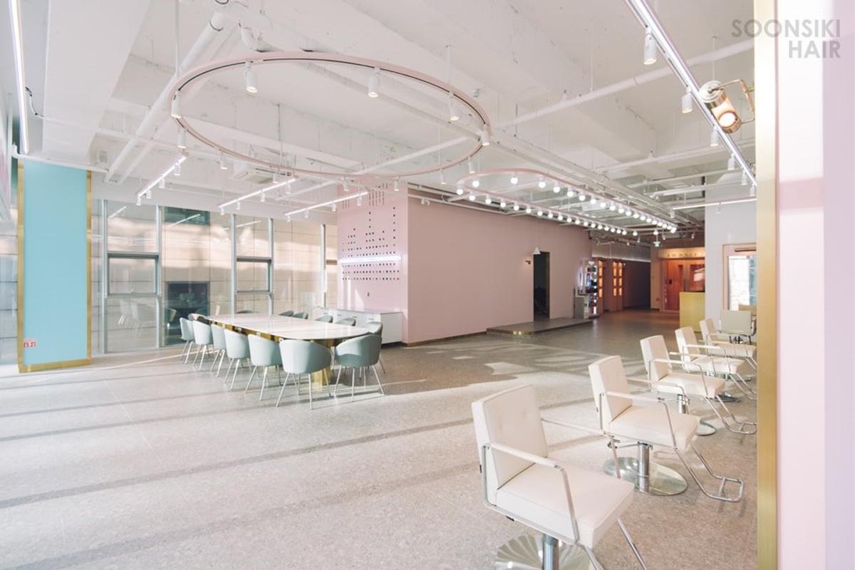 Salon seating at Soonsiki Hair Romantique designed to offer a refreshing experience.