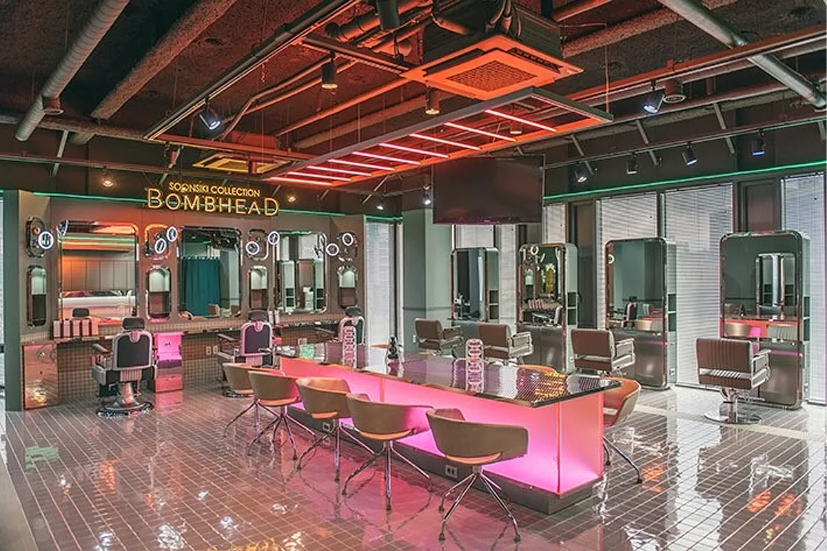 Modern interior of Soonsiki Hair salon in Hongdae featuring styling stations and seating area.