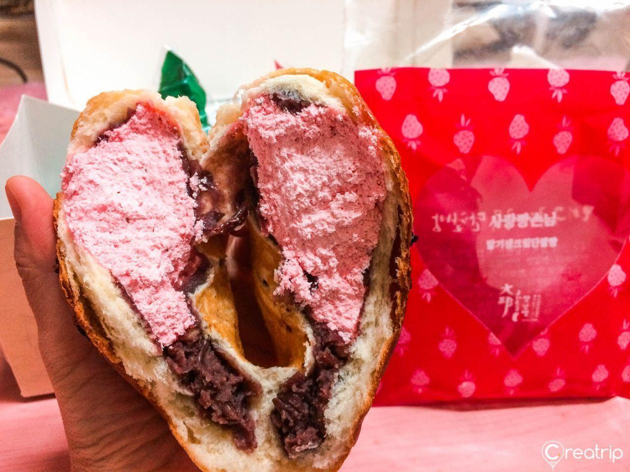 Close-up of creamy fillings in Kundaegol red bean buns.