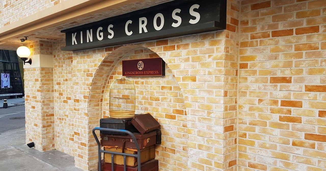 KING'S CROSS inspired exterior at a themed venue in Hongdae with vintage luggage decor.