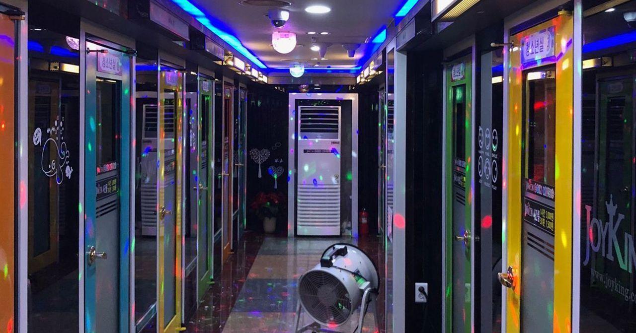 Vibrant karaoke hallway inside a popular entertainment venue in Hongdae.