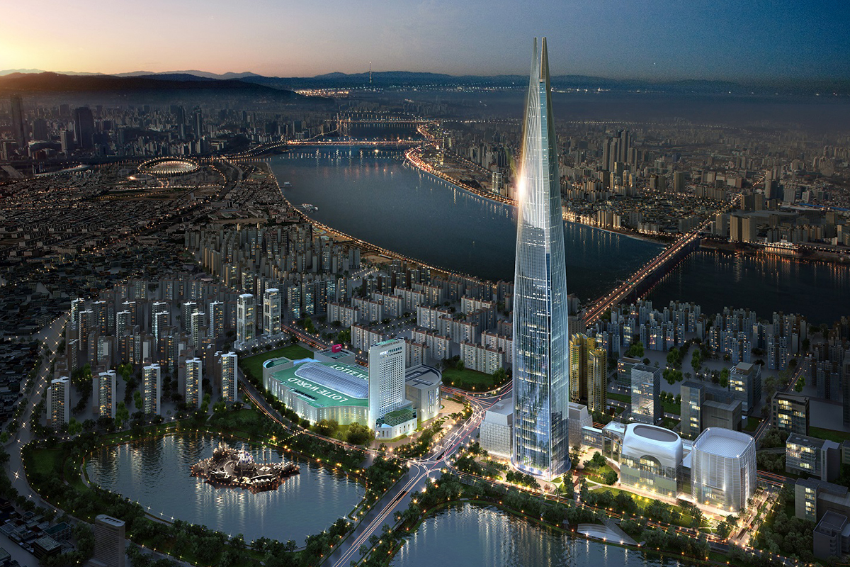 Nightview of Lotte Tower in Seoul, illuminating the skyline and reflecting off the Han River.