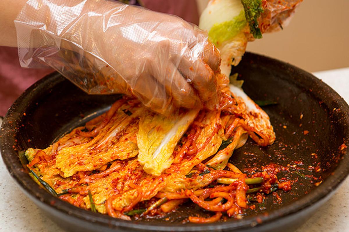 Traditional kimchi making tools and setup at the Seoul Kimchi Academy in Korea.