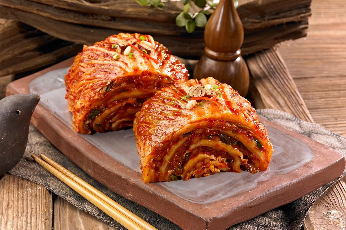 Kimchi pancake being made and enjoyed as part of the cooking class experience at Seoul Kimchi Academy.