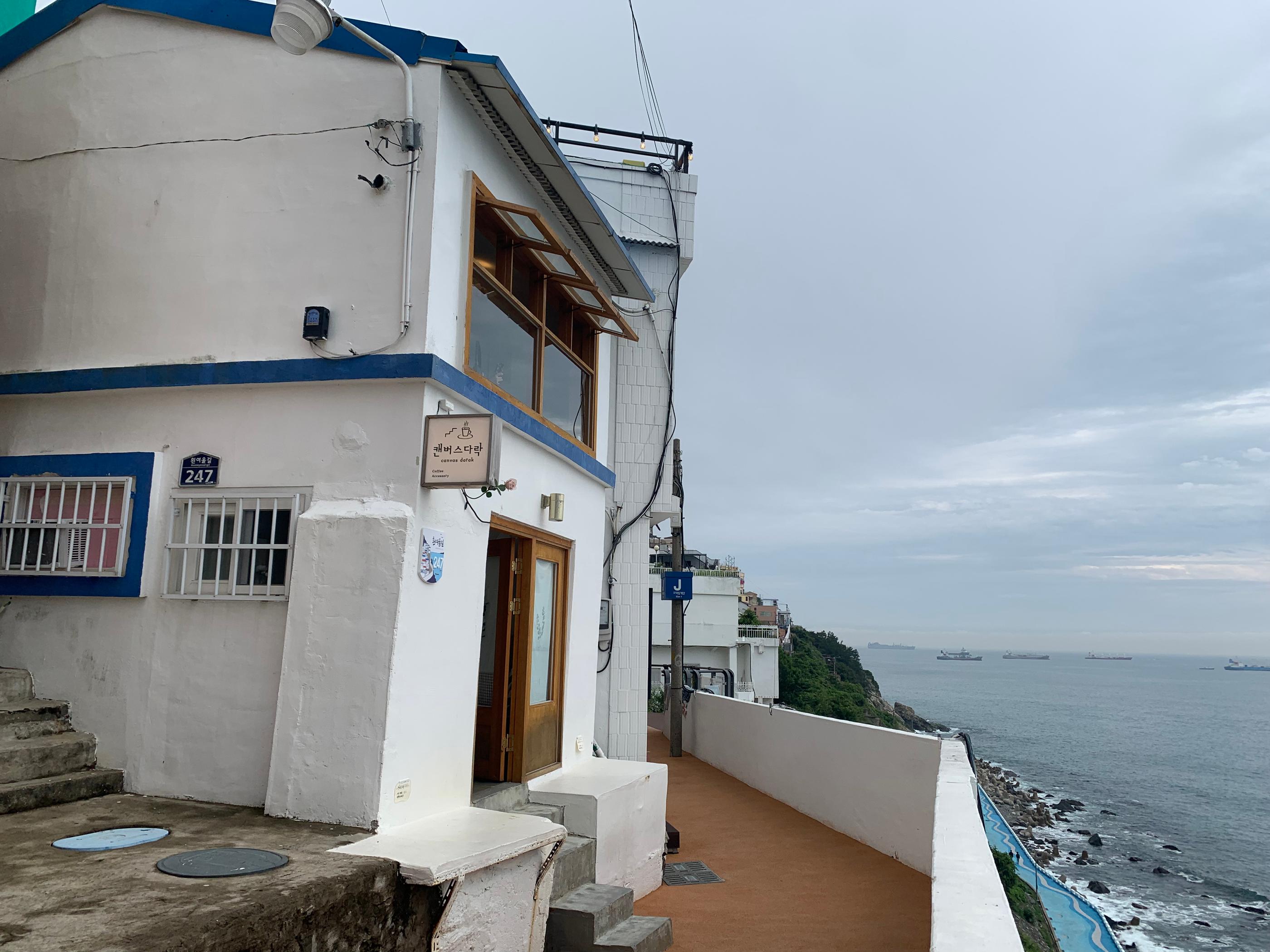 Blue and white buildings and ocean view in Huinnyeoul Culture Village