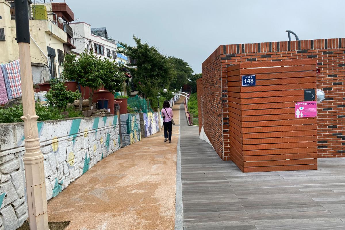 Road with public restroom in Huinnyeoul Culture Village