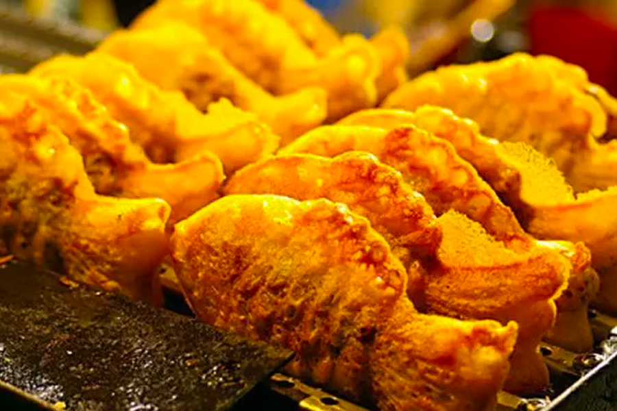 Freshly made Korean street snack Bungeoppang, fish-shaped pastry filled with sweet red bean paste, a popular winter treat.