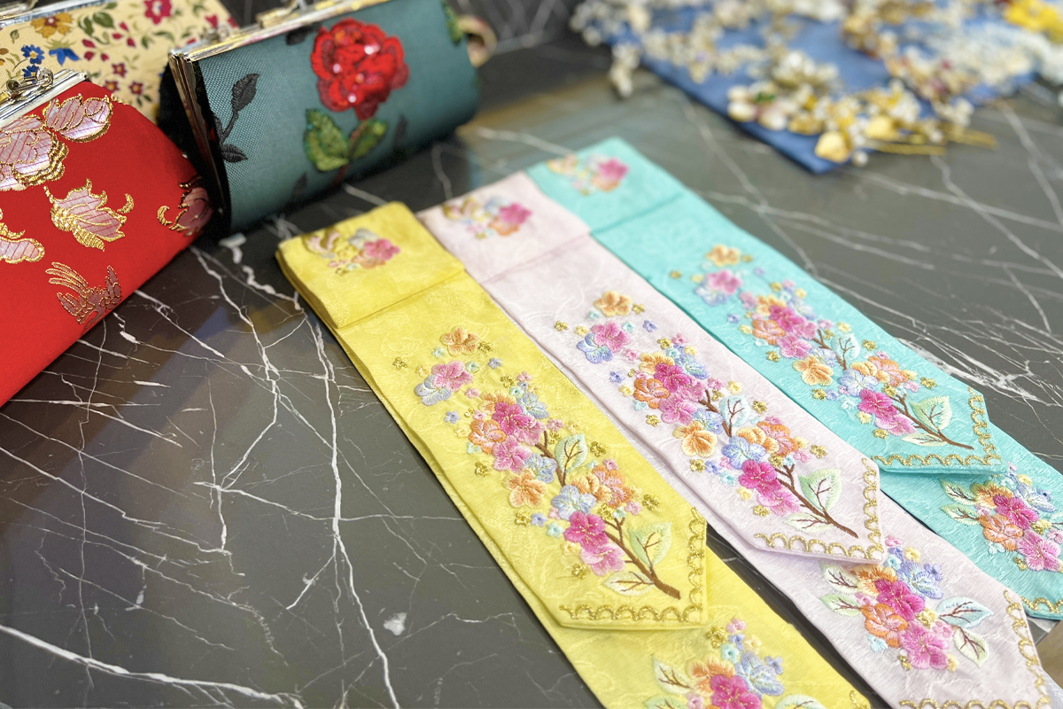 A collection of floral crowns and ribbons at Princess Hanbok rental store, offering visitors traditional Korean accessories to complement their hanbok experience.