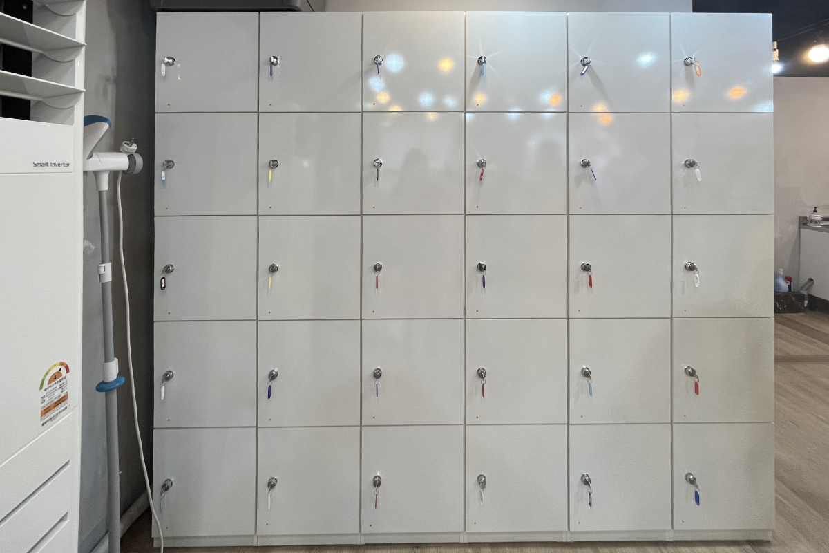 A vibrant collection of hanboks featuring floral patterns and bright colors, illustrating the diverse range available at Princess Hanbok for a unique cultural experience.