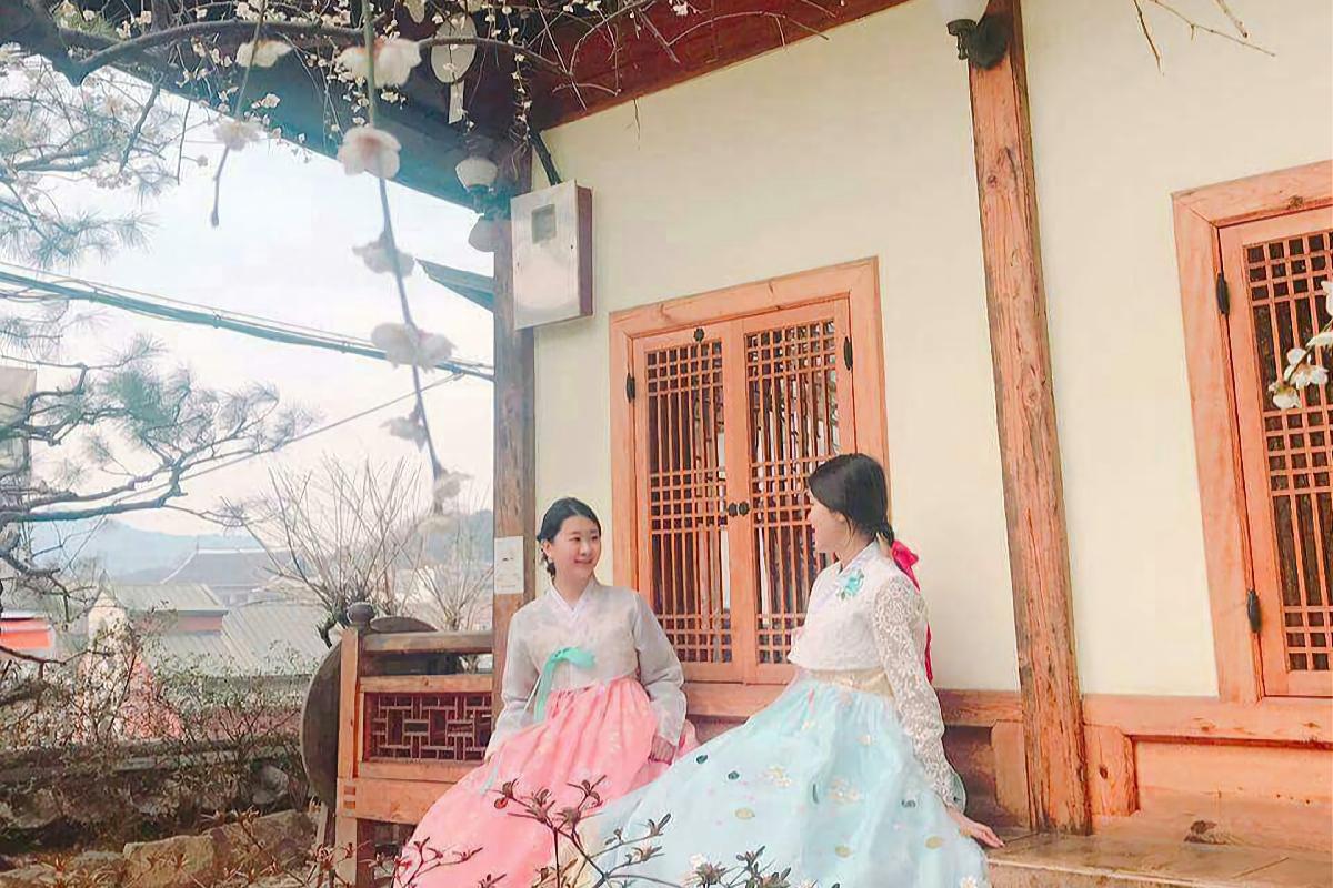 A tranquil image of a hanbok displaying graceful design and subtle colors, drawing tourists to explore the traditional elegance and style of Korean attire.