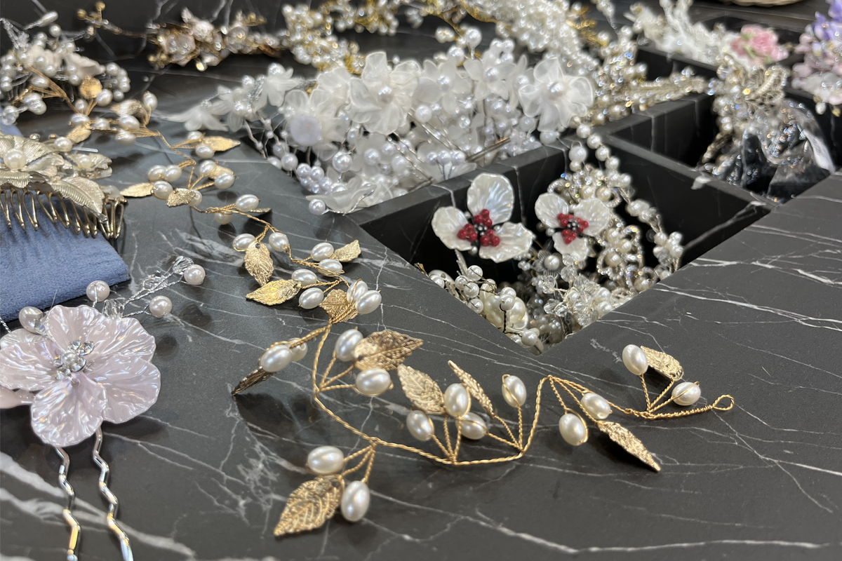 Rows of hanboks displayed in Princess Hanbok, highlighting the vibrant colors and cultural significance, inviting tourists to explore traditional Korean dress.