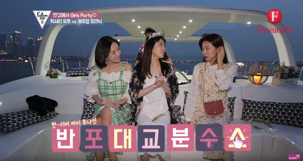 Luxury yacht on a nighttime cruise with a stunning view of Seoul's skyline and illuminated bridges from the Han River.