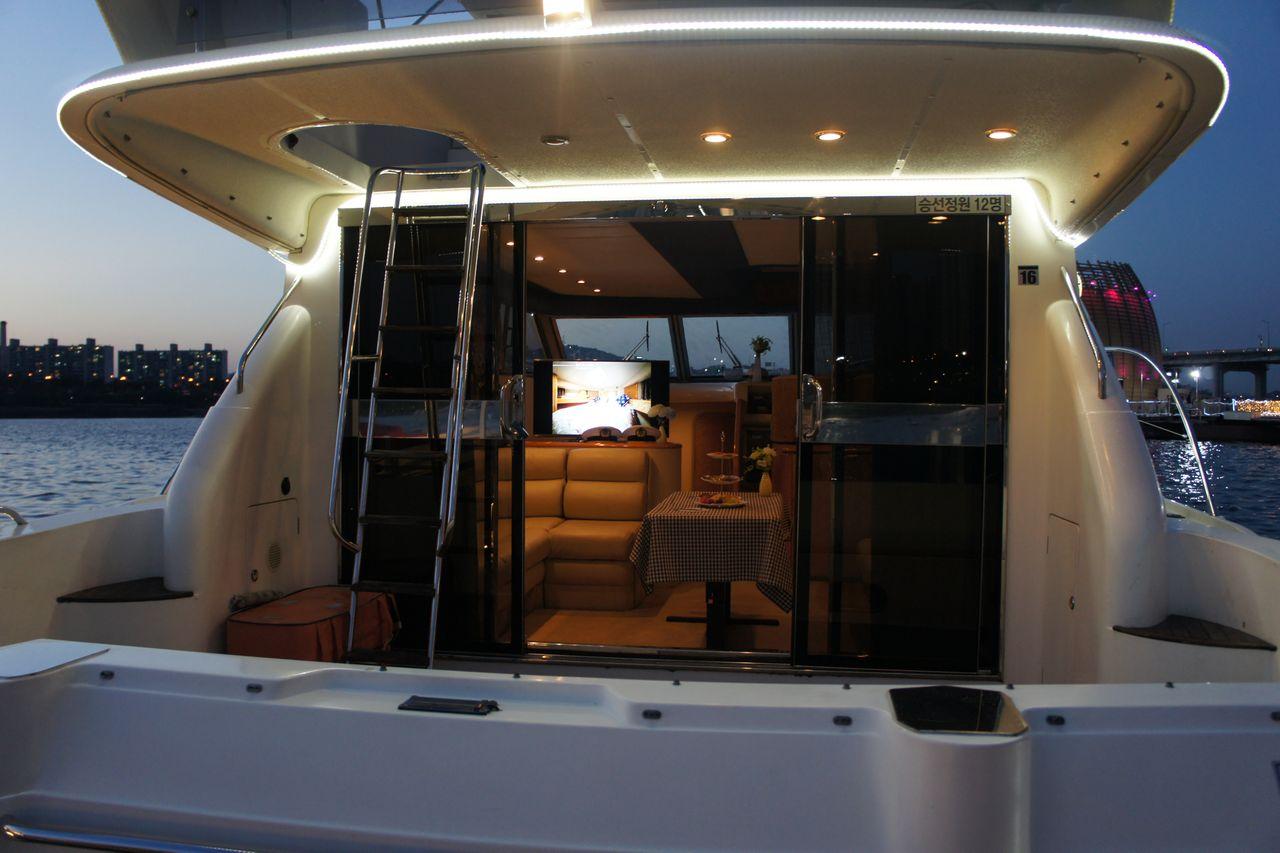 Princess Yacht docked at Golden Blue Marina on the Han River, showcasing its sleek design and elegant structure.