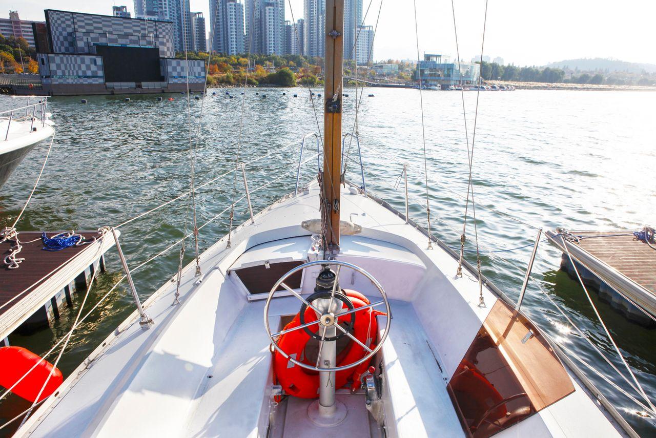Golden Blue Marina showcasing a fleet of luxury yachts waiting for a cruise along the scenic Han River in Seoul.