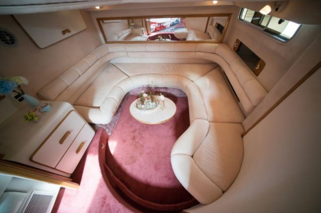 Outdoor deck of the Sea-Ray Yacht, offering a panoramic view of the Han River and Seoul cityscape during a cruise.