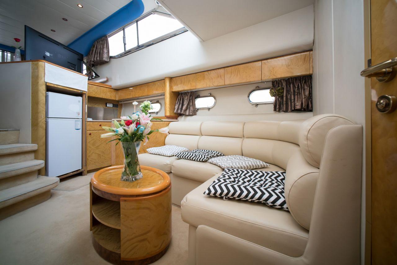 Spacious seating inside the Princess Yacht, offering a luxurious and comfortable cruising experience on the Han River.